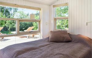 Postel nebo postele na pokoji v ubytování Awesome Home In Skibby With 3 Bedrooms, Sauna And Wifi