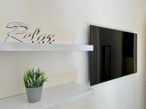 A television and/or entertainment centre at Angelina's Lovely Home