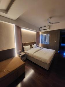 Ένα ή περισσότερα κρεβάτια σε δωμάτιο στο Ratnapriya hotel and resort