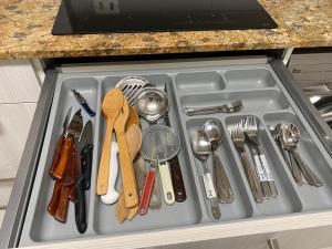 a drawer filled with utensils in a sink at ARTZA ETXIE LA CASA EBI01934 in Bermeo