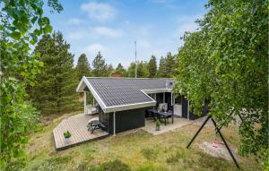 an overhead view of a small house with a deck at Amazing Home In Rm With 3 Bedrooms And Wifi in Bolilmark
