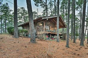 a house in the middle of the forest at Rockingham Cabin on 75 Acres with Lake Access! in Rockingham