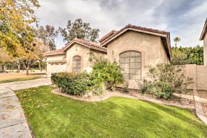 a house with a green yard at Phoenix Home with Private Pool about 8 Mi to Dtwn in Phoenix