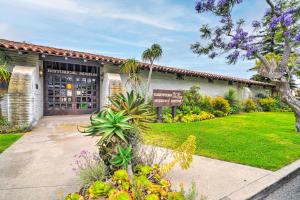 a building with a sign in front of a yard at Quiet Carpinteria Cottage By Town and Beaches in Carpinteria