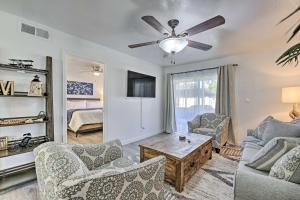 a living room with a couch and chairs and a ceiling fan at Downtown Gilbert Condo with Screened Porch! in Gilbert