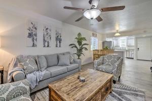 a living room with a couch and a table at Downtown Gilbert Condo with Screened Porch! in Gilbert