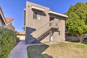 a house with a staircase on the side of it at Downtown Gilbert Condo with Screened Porch! in Gilbert