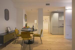 a kitchen and dining room with a table and chairs at MILAN Lux Apartment-Hosted by Sweetstay in Milan