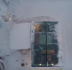 a glass window in a room with a wall at Levi Secret Igloo Revontuli in Sirkka