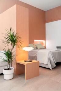 A bed or beds in a room at LOFT DESIGN GRANADA CENTER 2min CATHEDRAL FREE WIFI