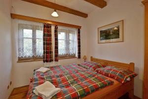 Postel nebo postele na pokoji v ubytování Miniresort AMULET
