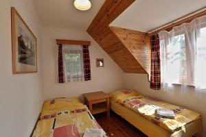 Postel nebo postele na pokoji v ubytování Miniresort AMULET