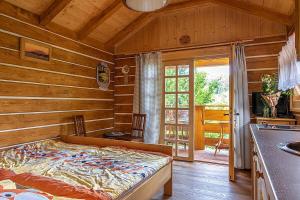 Postel nebo postele na pokoji v ubytování Miniresort AMULET