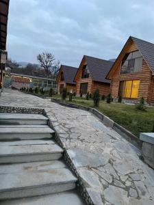 a stone walkway in front of a house at Riverside Eco Resort in Debed