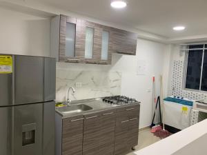 Ett kök eller pentry på Apartamento confortable - Caribe Campestre