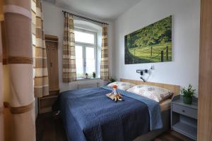 Postel nebo postele na pokoji v ubytování Apartmány U Aloise