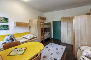 Postel nebo postele na pokoji v ubytování Apartmány U Aloise