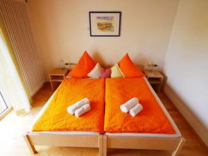 Ferienwohnung 8 tesisinde bir odada yatak veya yataklar