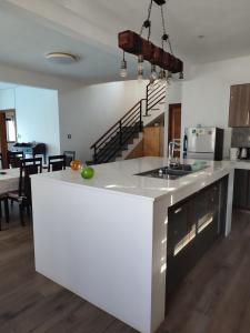 a kitchen with a white counter top in a room at Beautiful House with private pool in Mauritius in Albion