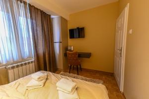 Postel nebo postele na pokoji v ubytování BANE APARTMANI 5