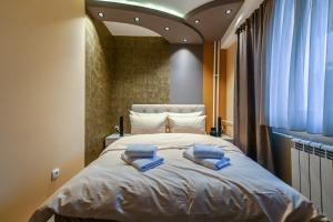 Postel nebo postele na pokoji v ubytování BANE APARTMANI 5
