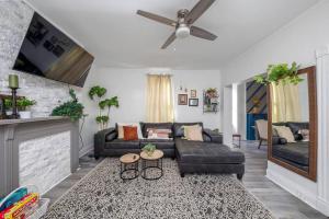 a living room with a couch and a fireplace at Newly Renovated House-10 Minutes From Downtown in Cincinnati