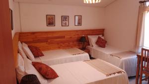 Cama ou camas em um quarto em Pousada Caminhos de Minas Belo Horizonte