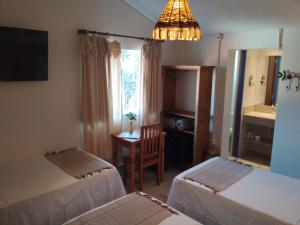 Cama ou camas em um quarto em Pousada Caminhos de Minas Belo Horizonte