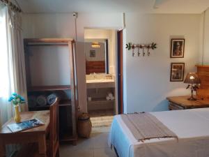 Cama ou camas em um quarto em Pousada Caminhos de Minas Belo Horizonte