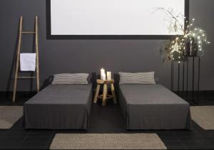 Giường trong phòng chung tại Hotel Galaxie