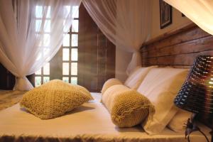 Cama ou camas em um quarto em Pousada Caminhos de Minas Belo Horizonte