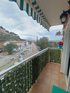 a balcony with a view of a street at Gran apartamento cerca del mar y Castillo in Denia