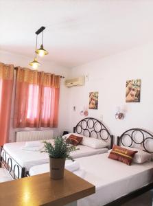 Postel nebo postele na pokoji v ubytování Ιno Skiathos