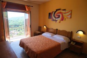 Postel nebo postele na pokoji v ubytování Aparthotel Amelia Dream View