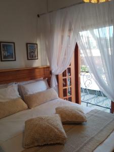 Cama ou camas em um quarto em Pousada Caminhos de Minas Belo Horizonte