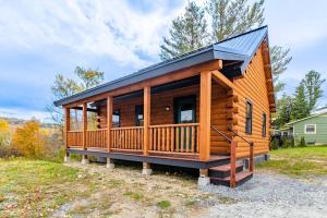 a large wooden cabin with a black roof at Florida Mountain Log Cabin in Florida