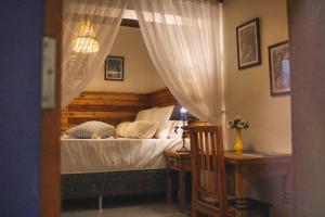 Postel nebo postele na pokoji v ubytování Pousada Caminhos de Minas Belo Horizonte