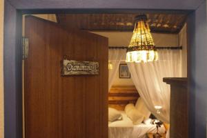 Cama ou camas em um quarto em Pousada Caminhos de Minas Belo Horizonte