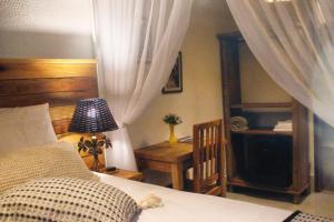 Cama ou camas em um quarto em Pousada Caminhos de Minas Belo Horizonte
