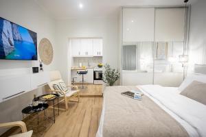 Posteľ alebo postele v izbe v ubytovaní Davina The City Central Suite
