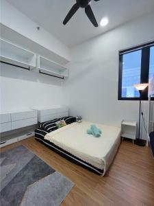 a bedroom with a bed and a ceiling fan at Beacon Executive Suite by Fantabulous Guest House in George Town