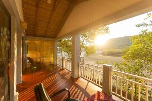 a balcony of a house with a view of a river at DreamCatcher Unique Retreat Yoga & Spa in Palolem