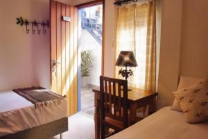 Cama ou camas em um quarto em Pousada Caminhos de Minas Belo Horizonte