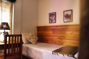 Cama ou camas em um quarto em Pousada Caminhos de Minas Belo Horizonte
