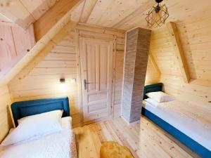 a room with two beds in a attic at Dušan_guest_house in Kolašin