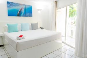 Letto o letti in una camera di Paradise Beach Hotel & Resort