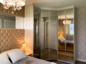 Ένα ή περισσότερα κρεβάτια σε δωμάτιο στο Apto Luxo Centro Gramado