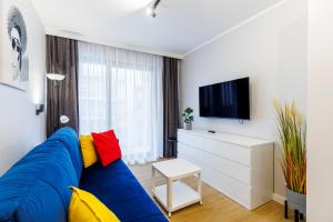 Telewizja i/lub zestaw kina domowego w obiekcie Balticus Apartamenty Standard Promenada Gwiazd 14