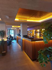 a lobby of a restaurant with a bar at Milmari Apartments Pahulja N Lux in Kopaonik