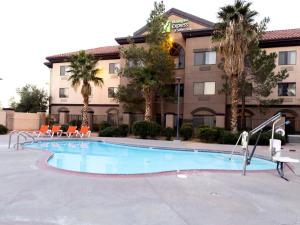 a swimming pool in front of a hotel at Holiday Inn Express Hotel & Suites Barstow, an IHG Hotel in Barstow